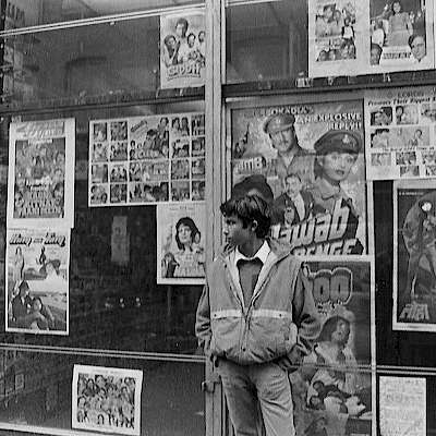 Youth in front of a video and music shop
